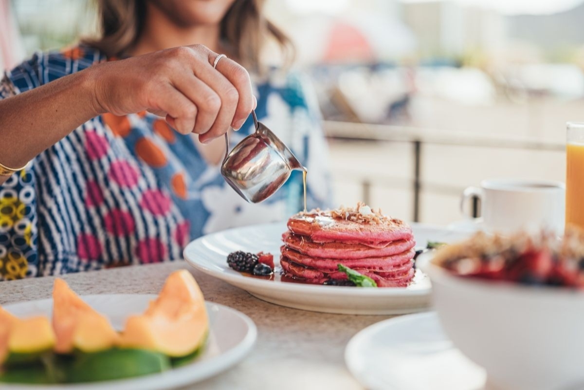 Royal Hawaiian’s signature Pink Palace Pancakes topped with mixed berries and syrup