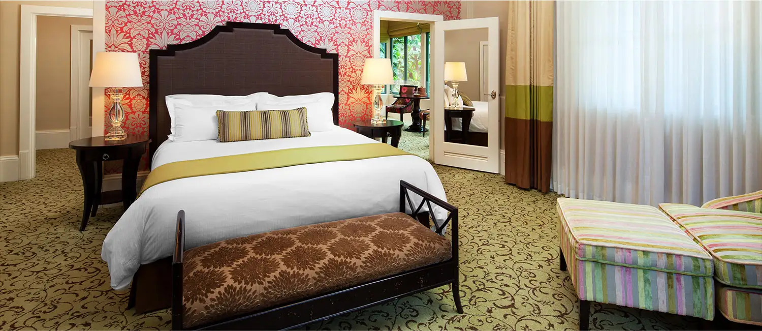 Spacious suite bedroom filled with natural light.