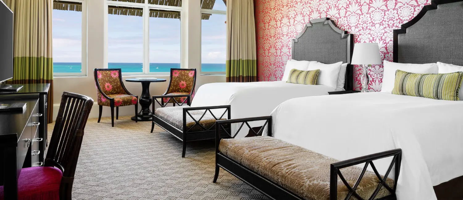 Bedroom of the Historic Ocean Deluxe with a view of the ocean.